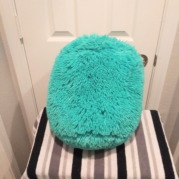 teal furry pillow